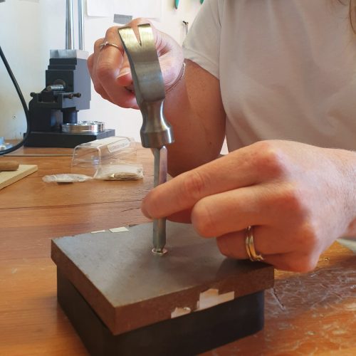 The hand stamping method uses metal stamps (also known as punches) and a hammer to create a struck mark in the metal to create a special personalised piece of jewellery.